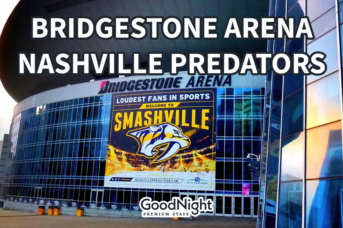 A close-up exterior view of Bridgestone Arena’s illuminated signage, with visible Nashville Predators branding and a 'Welcome to Smashville' banner. The arena’s modern exterior is lit up, hinting at the buzz and excitement of live events inside.